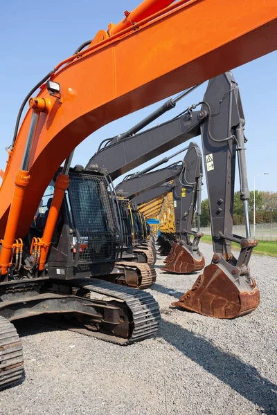 Vertikal Bild Rad Grävmaskiner Byggarbetsplats — Stockfoto