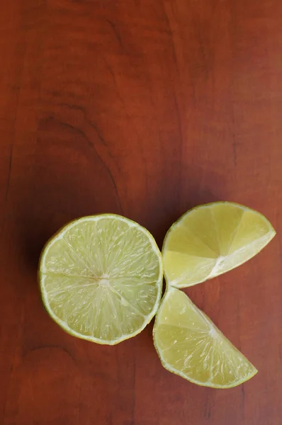 Vertical Shot Fresh Lime Wooden Background — Stock Photo, Image