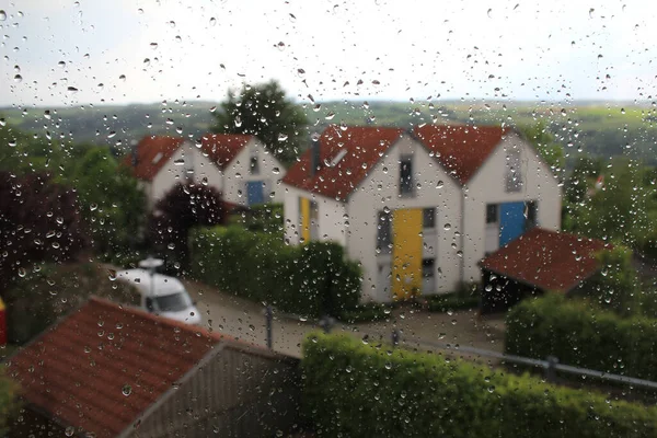 Closeup Shot Rainy Window Houses Trees — Stock Photo, Image