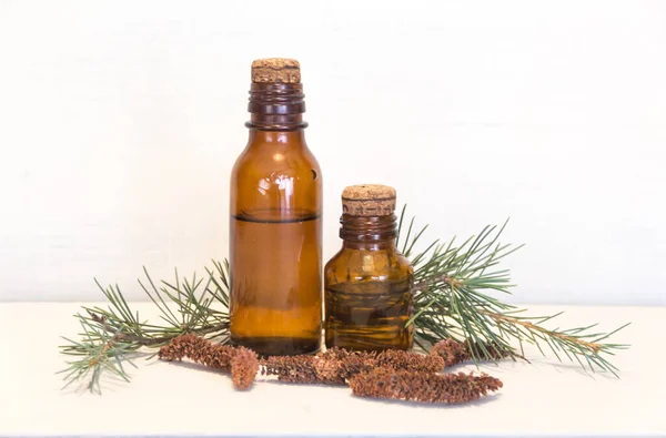 Bottles with cedar oil. Aromatherapy and natural cosmetics concept