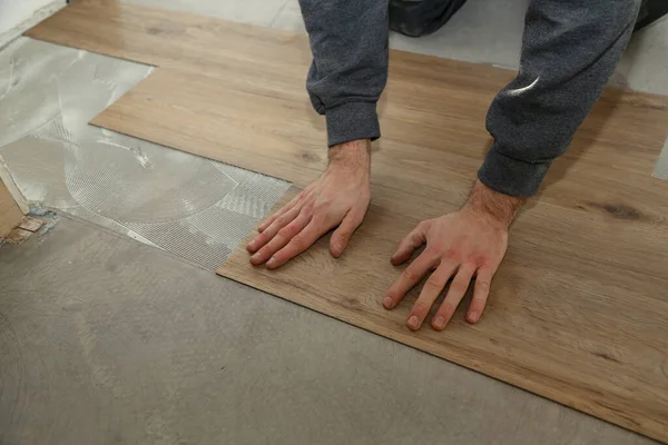 Closeup Shot Person Installing New Wooden Floors — Stock Photo, Image