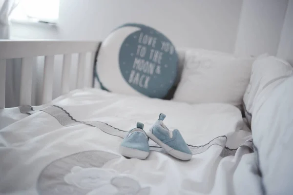 Closeup Shot Newborn Shoes Bed — Stock Photo, Image