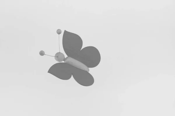 Grayscale Shot Wooden Handmade Butterfly Isolated Gray Background — Stock fotografie