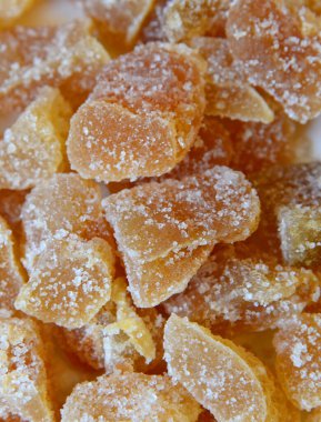 A heap of crystallized/crystallised ginger pieces viewed from above. clipart