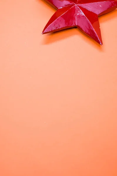 Κάθετη Λήψη Χριστουγεννιάτικου Στολισμού Σχήμα Αστεριού Πορτοκαλί Επιφάνεια — Φωτογραφία Αρχείου