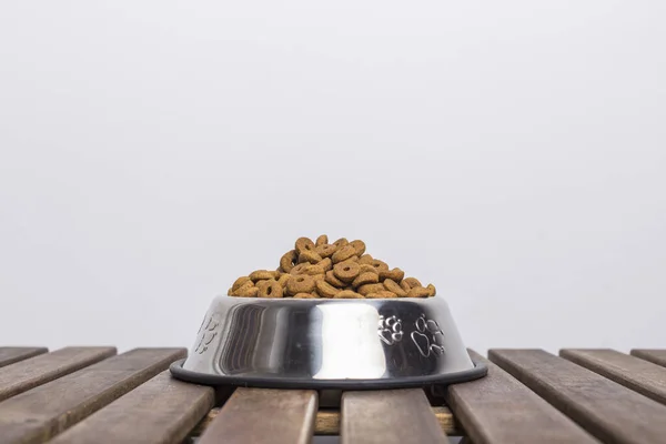 Silver Bowl Full Dog Food Wooden Table White Background — Stock Photo, Image