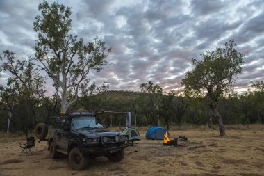 DARWIN, AUSTRALIA - Jul 17, 2020: A SUV or four by four tented campsite in the remote outback of Australia clipart
