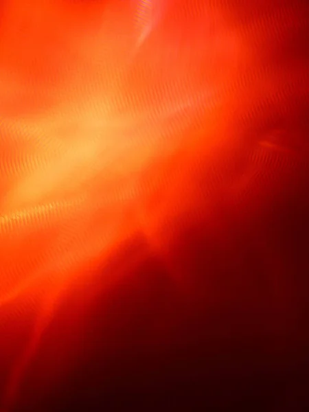 抽象的な背景のための集束されていない赤オレンジ色のぼやけたテクスチャパターンのショット — ストック写真