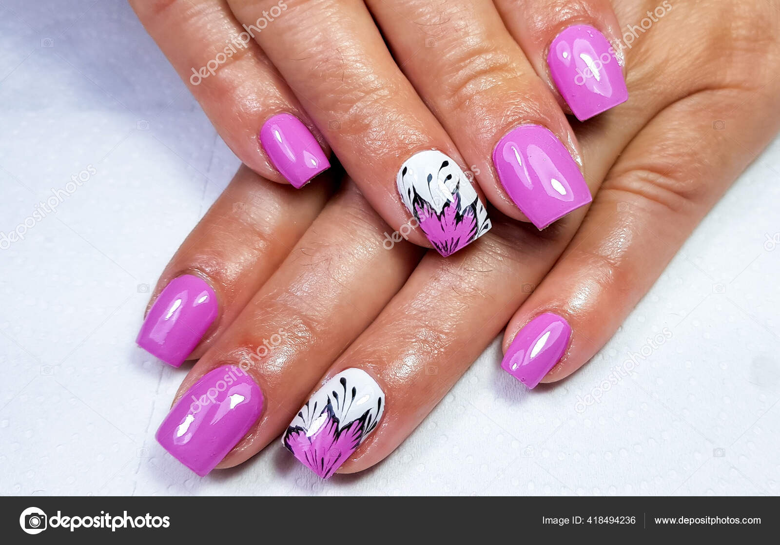Premium Photo | A nail art design with purple and purple nails