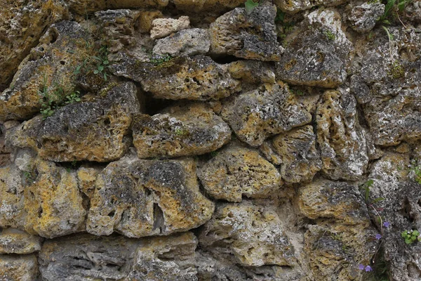 Egy Közeli Kép Egy Texturált Fal Kövek Tökéletes Háttér — Stock Fotó