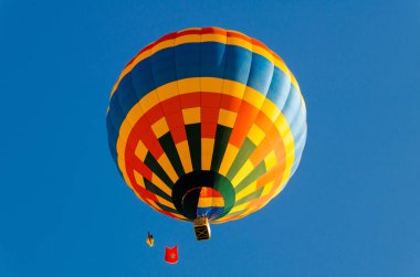 A colorful big hot air balloon during the Balloon Festival in Igualada, Barcelona clipart
