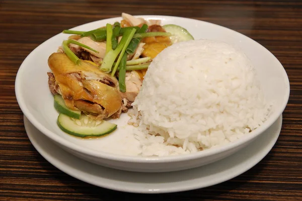 Hainanese chicken with cucumber and rice meal