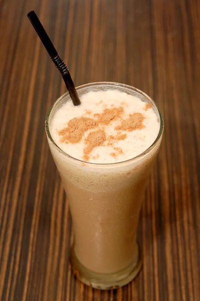 Coffee shake drink on glass with straw