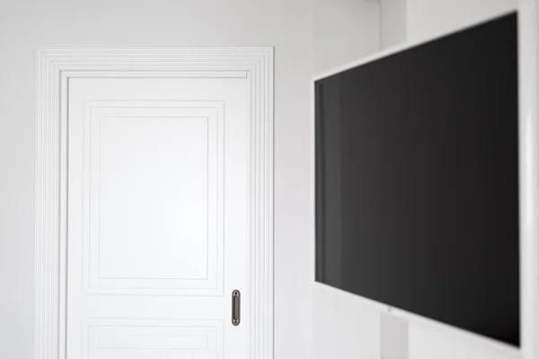 copy space white interior with door wall and tv in classic modern interior