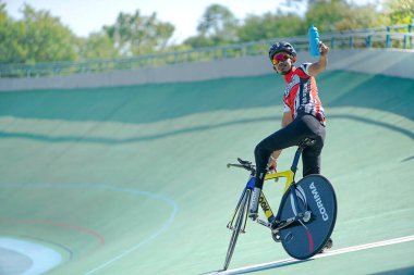 Surakarta Indonesia June 17 2020 : Action tracking para cycling shot of training cyclists racing on track in velodrome. Spirit for competition clipart