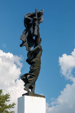 Russia, Luga, Leningrad oblast - 11 July 2020: photo shows a warrior with a machine gun in his hand. This is Monument 
