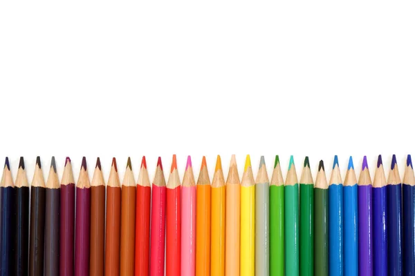 Rainbow from set of colored pencils on white background close up view with free space for your text — Stock Photo, Image