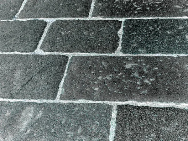 Medieval gray stone pavement with recesses — Stock Photo, Image