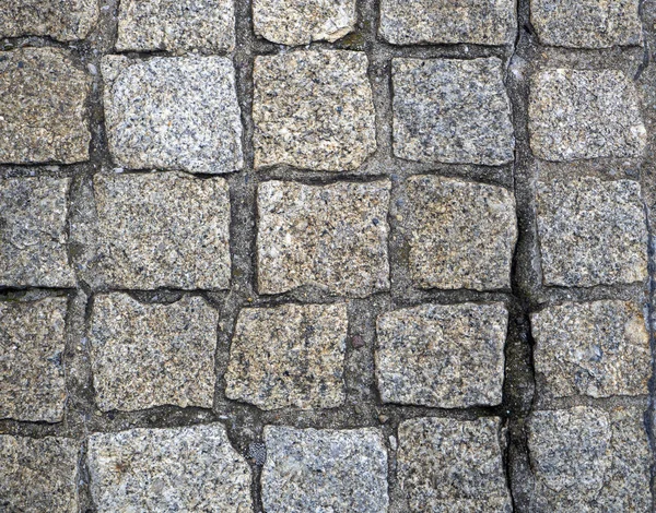 Stone pavers are lined with cobblestones of the same type — Stock Photo, Image
