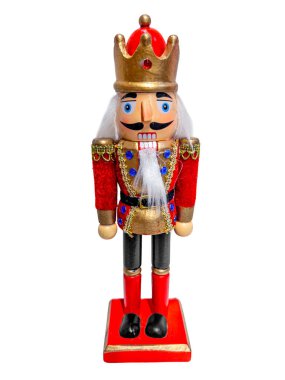 Fındıkkıran kralı eski bir askeri üniforma giyiyor. Geleneksel bir Noel figürü beyaza izole edilmiş, kırpma yolu da dahil.