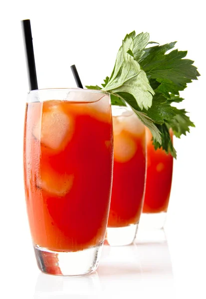 Three Bloody Mary with ice cubes with celery isolated on white — Stock Photo, Image