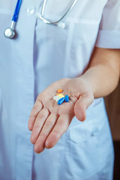 hands of doctor with pills closeup