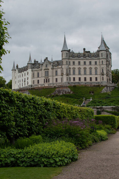 Fairytale view of Dunrobin Castle, with a magnificent garden full of flowers, Sutherland, Scotland, Britain
