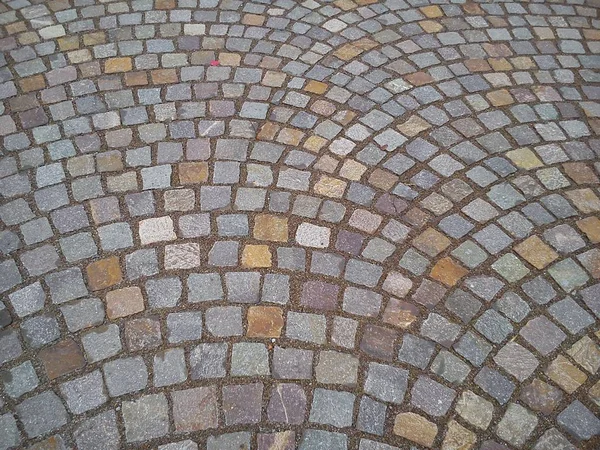 Cobblestone square of the old city of square stones.