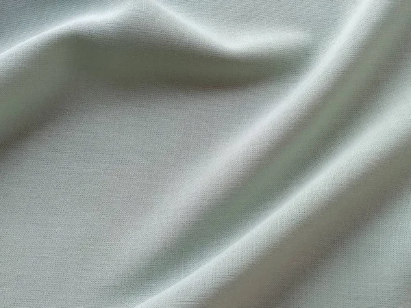Beautifully Folded Light Green Fabric Soft Pleasant Waves Flounces Textiles — Stock Photo, Image
