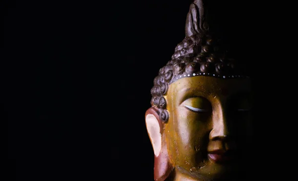 Buddha head with golden colors Royalty Free Stock Images