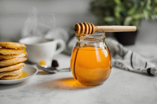 Jar of honey close-up Stock Photo