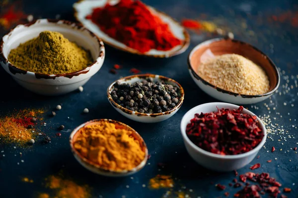 Various colorful spices  on concrete background