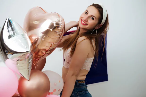 Happy woman, balloons and on a white wall background — Stock Photo, Image