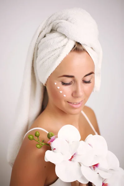 skin care and recovery.young girl with clean perfect skin. Blonde with natural touching her face. Spa