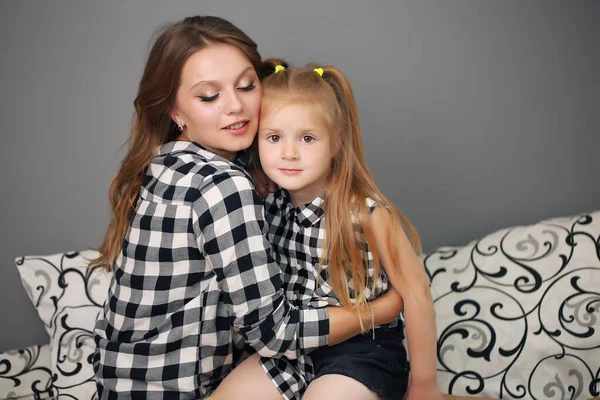 Happy loving family. Mother and her girl play, kiss and hug. — Stock Photo, Image