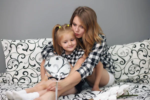 Happy loving family. Mother and her girl play, kiss and hug. — Stock Photo, Image