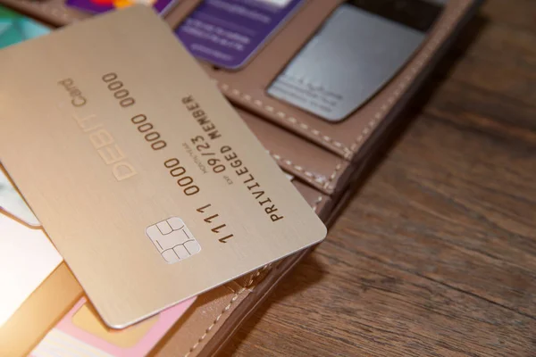Many credit cards or debit cards on wooden,master card