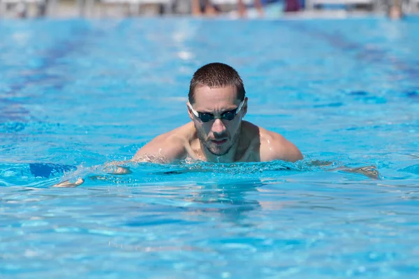 Close up shot of swimming man