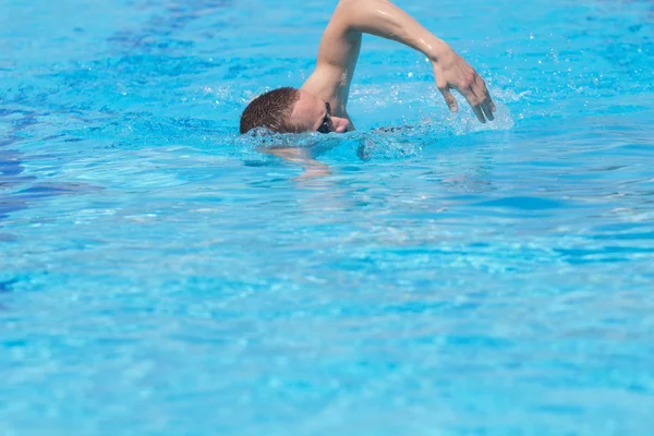 Close up shot of swimming man