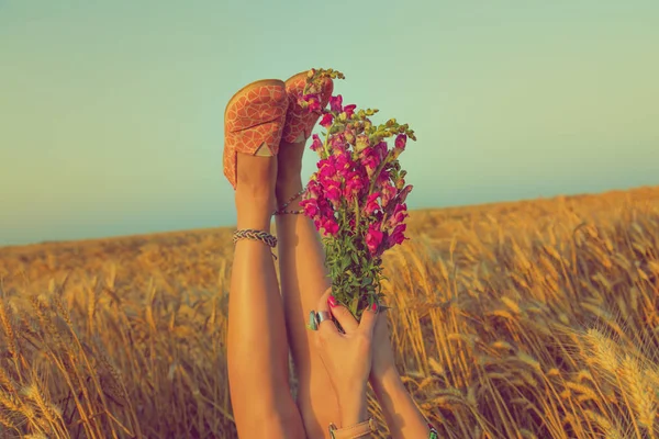 Woman Raising Legs Hands Bouquet Flowers While Lying Wheat Field — Stock Photo, Image