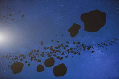 Meteor ve asteroid yıldızlı bir arka plan üzerinde