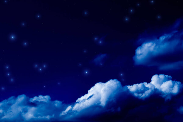 Bright stars shining in night sky with fluffy clouds, space concept