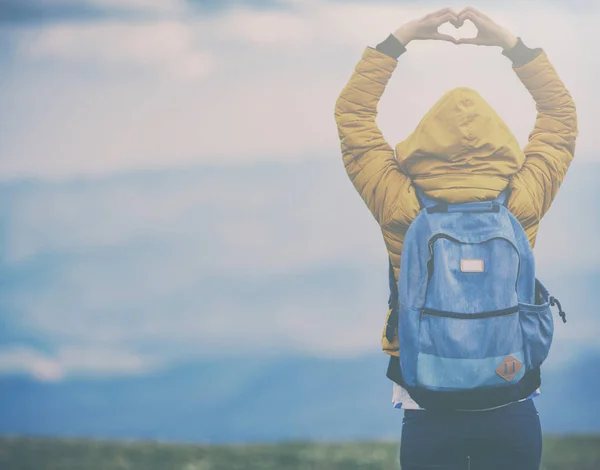 Back View Woman Wearing Warm Clothes Backpack Raised Hands Showing — Stock Photo, Image