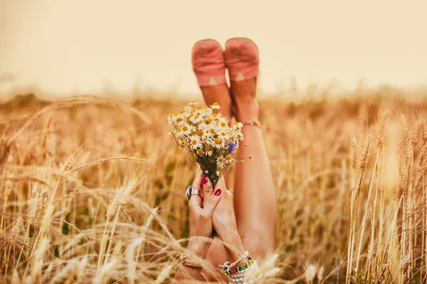 Woman Raising Legs Hands Bouquet Flowers While Lying Wheat Field — Stock Photo, Image