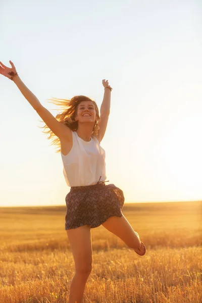 Woman Jumping Nature Arms Wide Open Stock Image