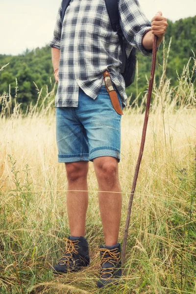 Young hiker in nature / wilderness - trekking outdoors.