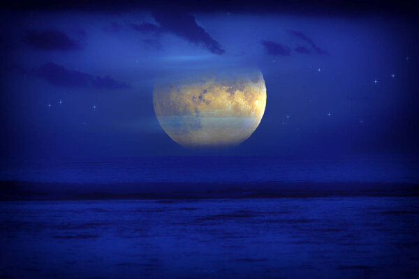 Exotic Moon and stars rising from the ocean horizon. My astronomy work.