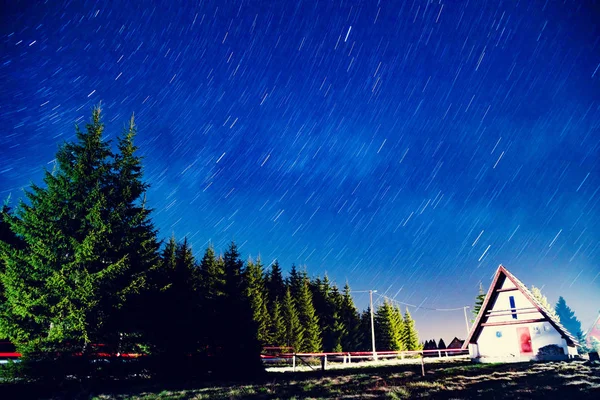 Star trails with countryside suburb silhouettes at night. My astronomy work.