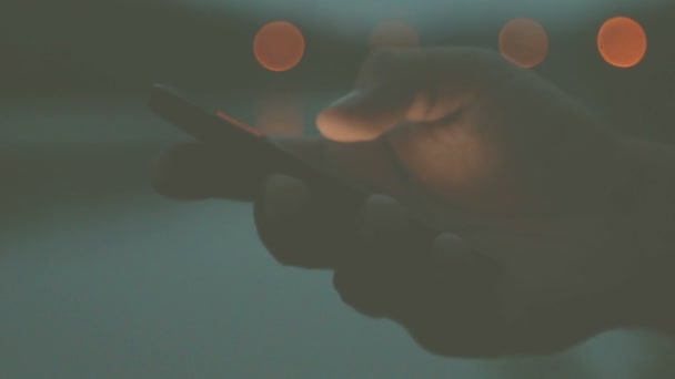 Male Hand Using Smartphone Blurred Urban Background Bokeh — Stock Video