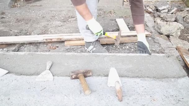 Worker Making Concrete Floor Removing Wooden Plank — Stock Video